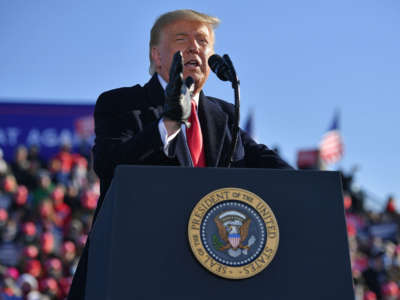 Then-President Donald Trump speaks during a campaign rally at Green Bay Austin Straubel International Airport in Green Bay, Wisconsin, on October 30, 2020.