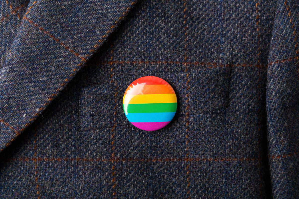 LGBTQ Pride flag pin on coat