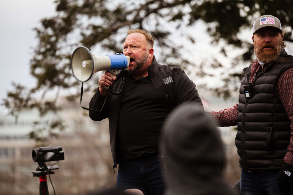Alex Jones, the founder of right-wing media group Infowars, addresses a crowd of pro-Trump protesters after they stormed the grounds of the Capitol Building on January 6, 2021, in Washington, D.C.
