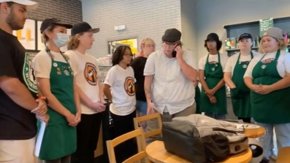 Unionized Starbucks workers in South Carolina present their manager with a list of demands before the manager walks out.
