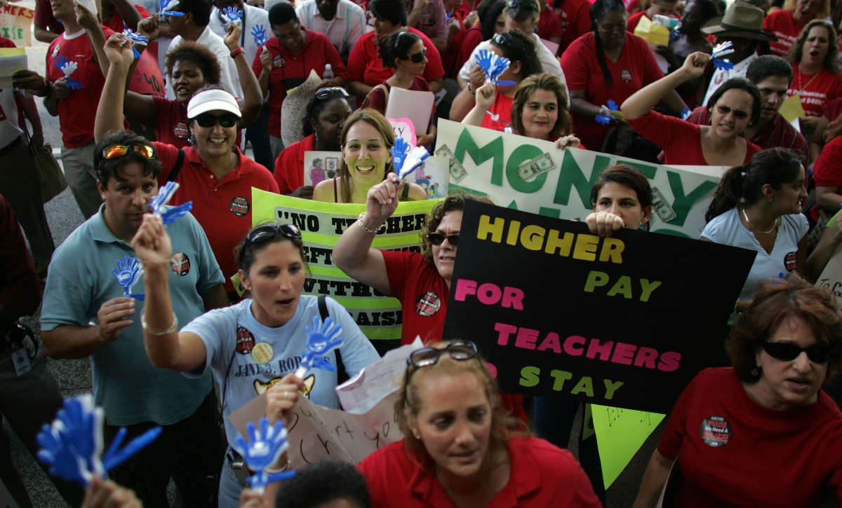 Miami-Dade County school teachers protest for higher wages saying they are the lowest paid in all of South Florida on October 11, 2006, in Miami, Florida.