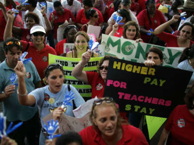 Miami-Dade County school teachers protest for higher wages saying they are the lowest paid in all of South Florida on October 11, 2006, in Miami, Florida.