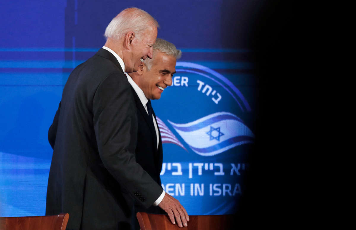 President Joe Biden, left, and Israel's caretaker Prime Minister Yair Lapid leave after signing a security pledge in Jerusalem, on July 14, 2022.