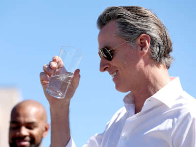 California Gov. Gavin Newsom tastes wastewater that was treated at the Antioch Water Treatment Plant on August 11, 2022, in Antioch, California.