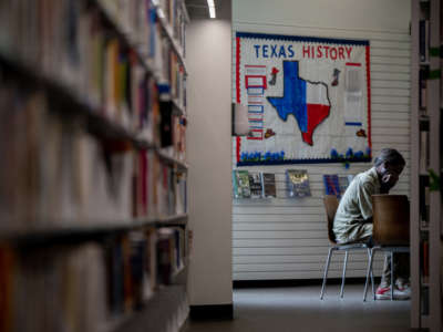 A person sits in the Houston Public Library on April 26, 2022, in Houston, Texas.
