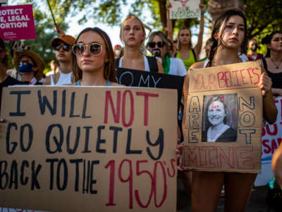 Protesters hold up signs during an abortion rights rally on June 25, 2022, in Austin, Texas.