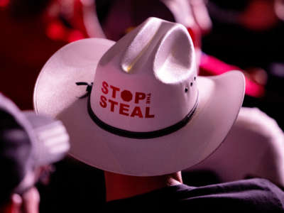 A person in a "Stop the Steal" cowboy hat attends a rally at the Arizona Federal Theater in Phoenix, Arizona, on July 24, 2021.