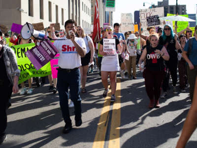 Abortion rights demonstrators march through the streets to protest the Supreme Court's decision in the Dobbs v. Jackson Women's Health Organization case on June 24, 2022, in Detroit, Michigan.