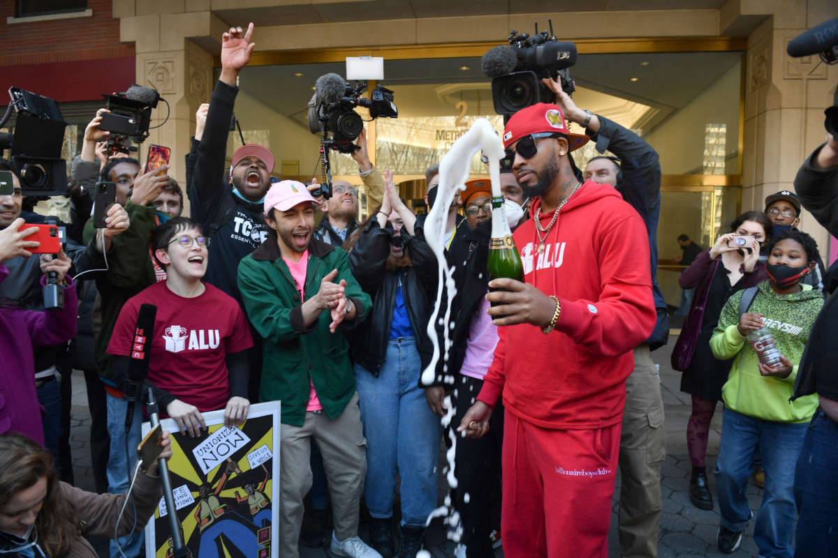 Union organizer Christian Smalls, right, celebrates following the April 1, 2022, vote for the unionization of the Amazon Staten Island warehouse in New York.