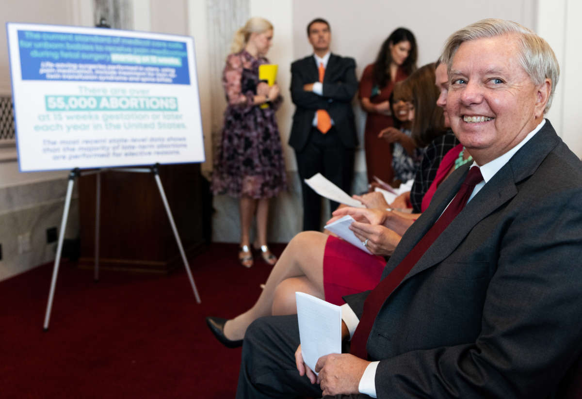 Sen. Lindsey Graham smiles before speaking during his news conference on Capitol Hill to announce a national bill on abortion restrictions on September 13, 2022.