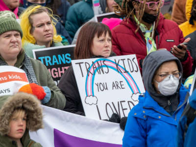 People hold a rally to support trans kids in St. Paul, Minnosota, on March 6, 2022.