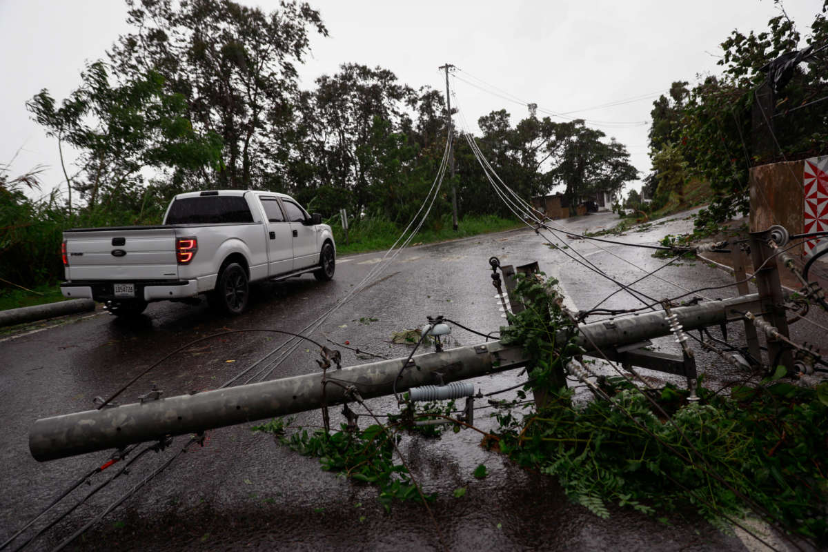 Downed power lines are seen on the road in San Juan, Puerto Rico, as the island awoke to a general power outage on September 19, 2022.