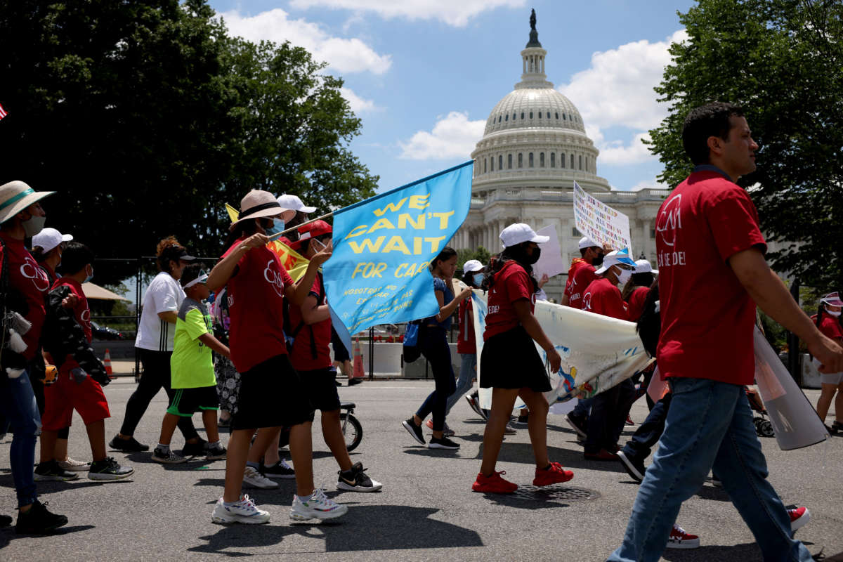 Demonstrators march during a We Cant Wait Rally, put on by CASA near the U.S. Capitol on June 24, 2021, in Washington, D.C.