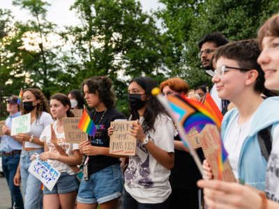 Students listen during a rally in support of inclusive Family Life Education outside of Luther Jackson Middle School in Falls Church, Virginia, on July 14, 2022.