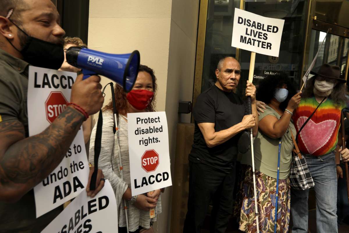 Roy Payan leads a protest of disabled students and other disabled members of the community in front of the LACCD Headquarters in Downtown Los Angeles on March 2, 2022.