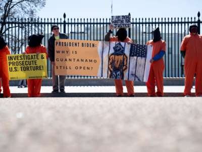 Demonstrators calling for the closure of the Guantánamo Bay detention facility gather in front of the White House in Washington, D.C., on April 2, 2022.