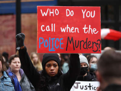 Demonstrators protesting the killing of Patrick Lyoya gather in front of the Grand Rapids police station on April 15, 2022, in Grand Rapids, Michigan.