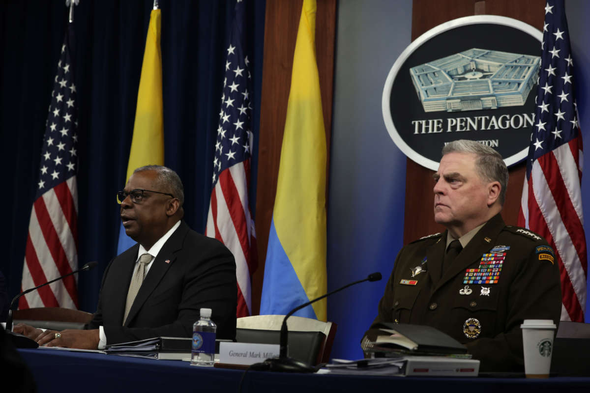 Secretary of Defense Lloyd Austin (left) gives opening remarks as Chairman of the Joint Chiefs of Staff General Mark Milley (right) listens during a virtual meeting of the Ukraine Defense Contact Group at the Pentagon May 23, 2022, in Arlington, Virginia.