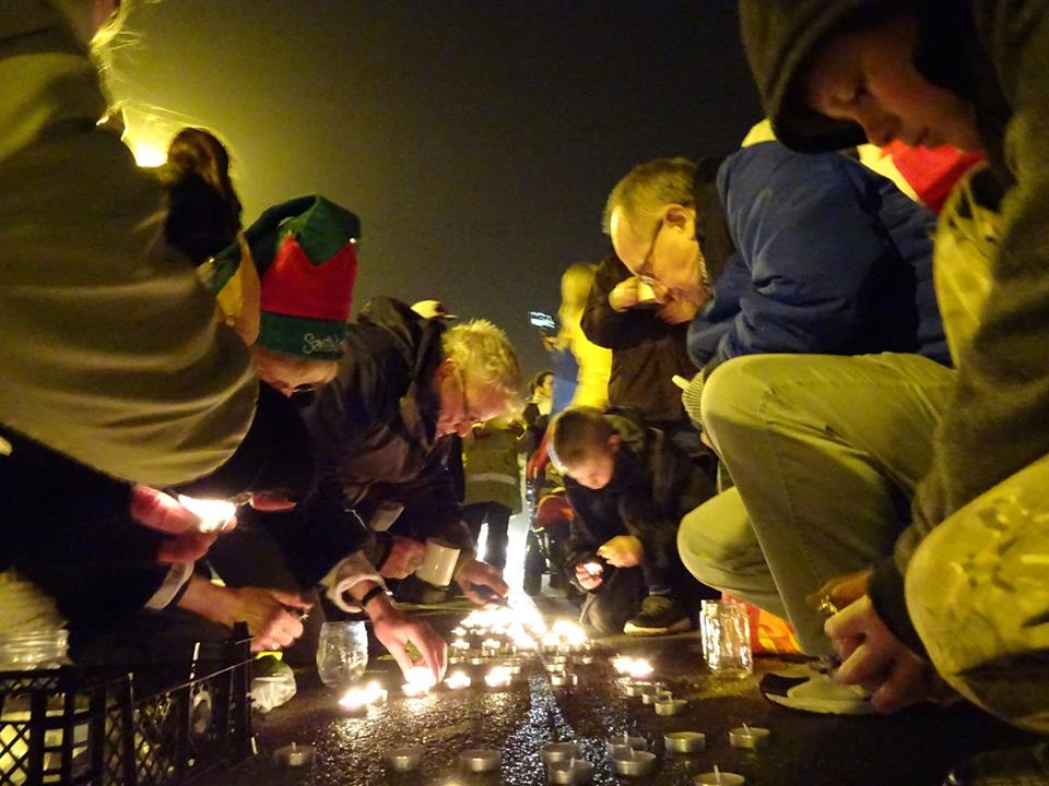 Residents living near the Preson New Road fracking site hold a candlelight vigil on Christmas Eve at the site entrance.