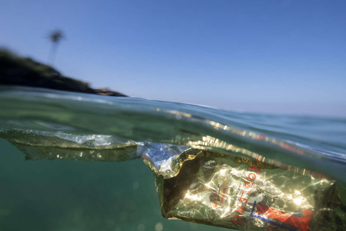 In this picture taken on December 31, 2021, a plastic bag floats in the waters of the Indian ocean near the town of Ahangama in Galle.