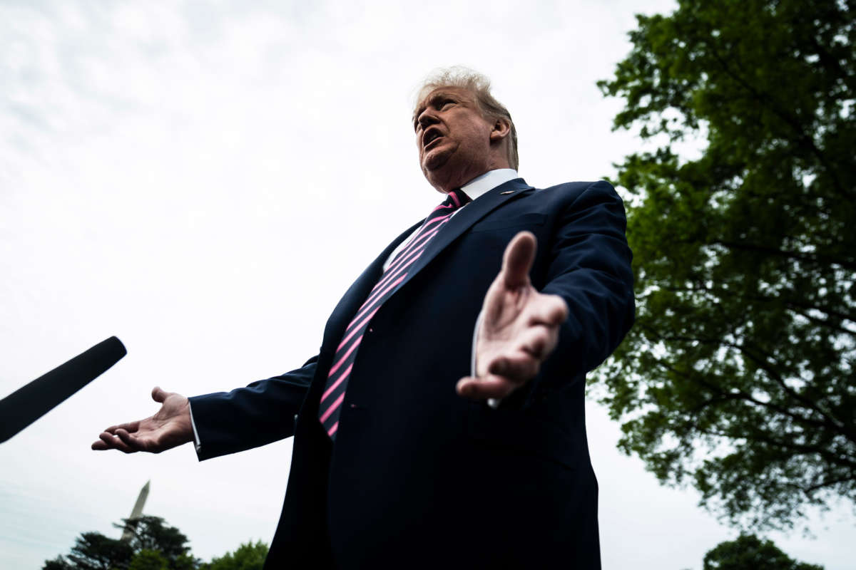 Then-President Donald Trump stops to talk to reporters on the South Lawn at the White House on May 5, 2020, in Washington, D.C.