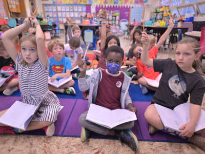 Students study reading in a second grade classroom at Bradley International School in Denver, Colorado, on September 29, 2022.