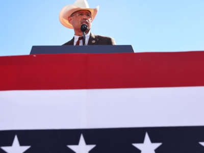 Mark Finchem, Republican nominee for Arizona secretary of state, speaks at a campaign rally attended by former President Donald Trump at Legacy Sports USA on October 9, 2022, in Mesa, Arizona.