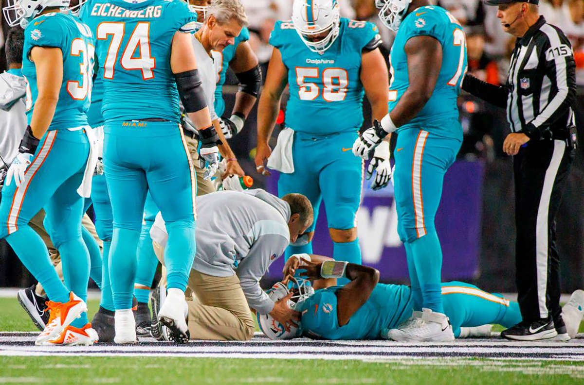 Miami Dolphins quarterback Tua Tagovailoa is attended to by medical staff after being sacked during the second quarter of an NFL football game at Paycor Stadium on September 29, 2022, in Cincinnati, Ohio.