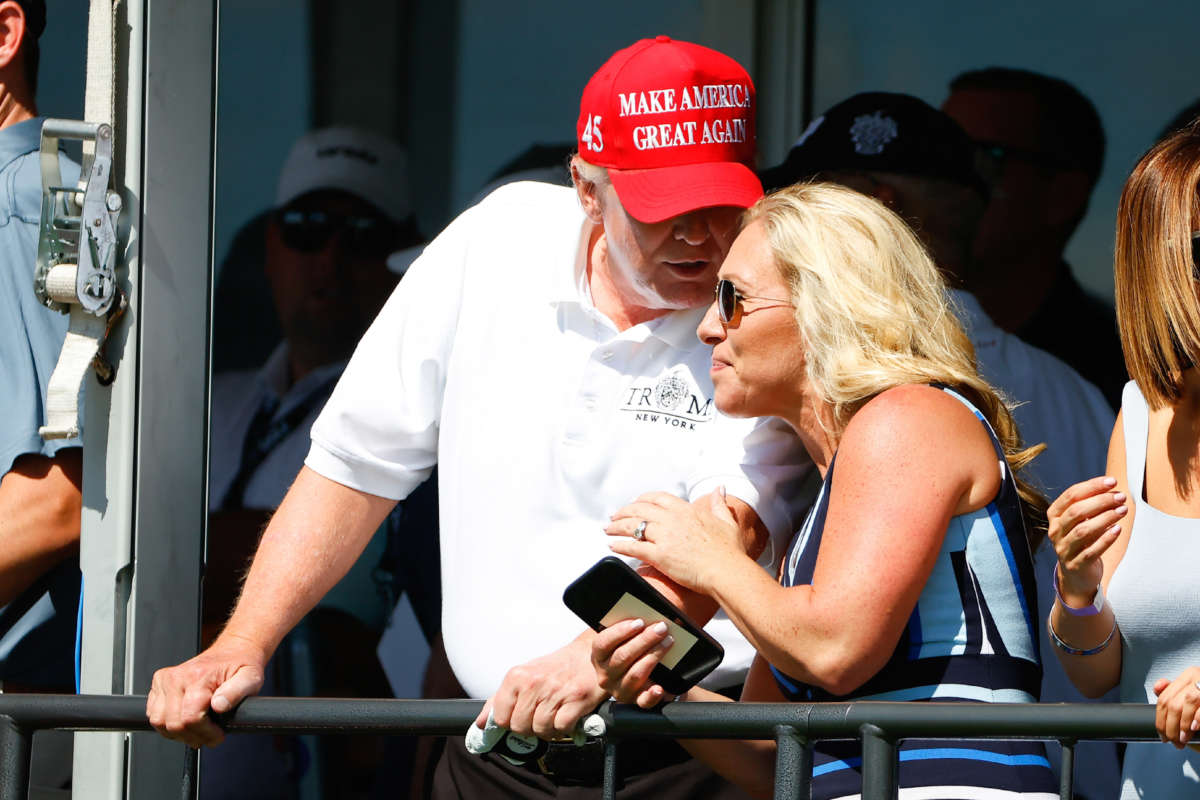 Former President Donald Trump and Rep. Marjorie Taylor Greene are pictured at the 16th tee during the second round of LIV golf invitational series on July 30, 2022, in Bedminster, New Jersey.