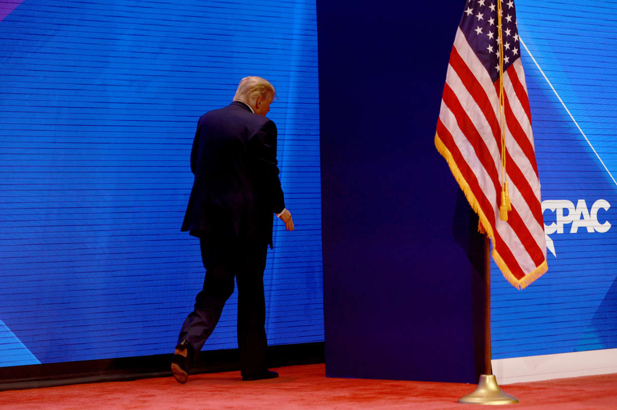 Former President Donald Trump walks off stage after speaking during the Conservative Political Action Conference (CPAC) at The Rosen Shingle Creek on February 26, 2022, in Orlando, Florida.