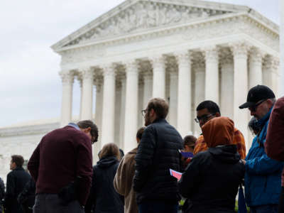 People wait in line outside the U.S. Supreme Court building to hear oral arguments on October 3, 2022, in Washington, D.C.