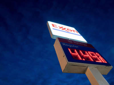 A sign displays the price of gas at an Exxon gas station in Washington, D.C., on March 13, 2022.