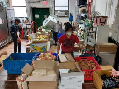 Woodbine organizes a food pantry in Ridgewood, New York, on July 8, 2022.