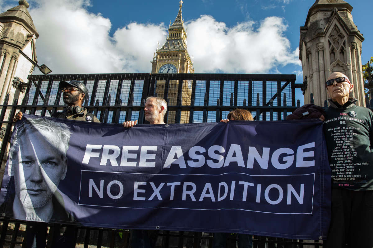 Hundreds of supporters of Julian Assange form a human chain around Parliament to demand the release of the imprisoned whistleblower on October 8, 2022 in London, U.K.