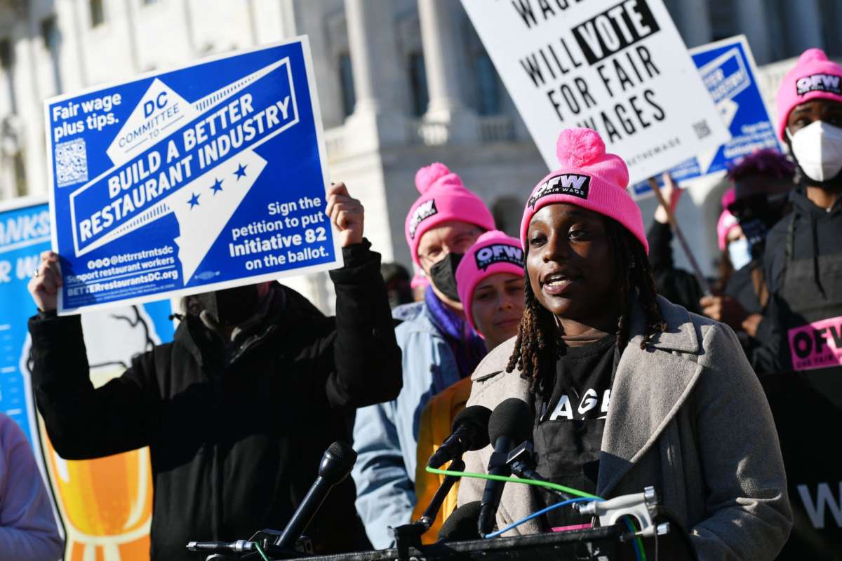 Restaurant worker Ifeoma Ezumaki speaks during a rally to call for restaurant workers to be paid a full minimum wage with tips at the House Triangle of the U.S. Capitol in Washington, D.C. on February 8, 2022.