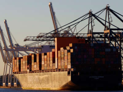 The Hapag-Lloyd Antwerpen Express container ship is unloaded at the GCT container terminal in Jersey City, New Jersey on September 24, 2022, as seen from Bayonne, New Jersey.