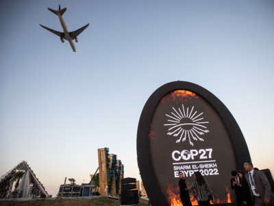 A plane flies over the Green Zone of the 2022 United Nations Climate Change Conference COP27 in Sharm El-Sheikh, Egypt.