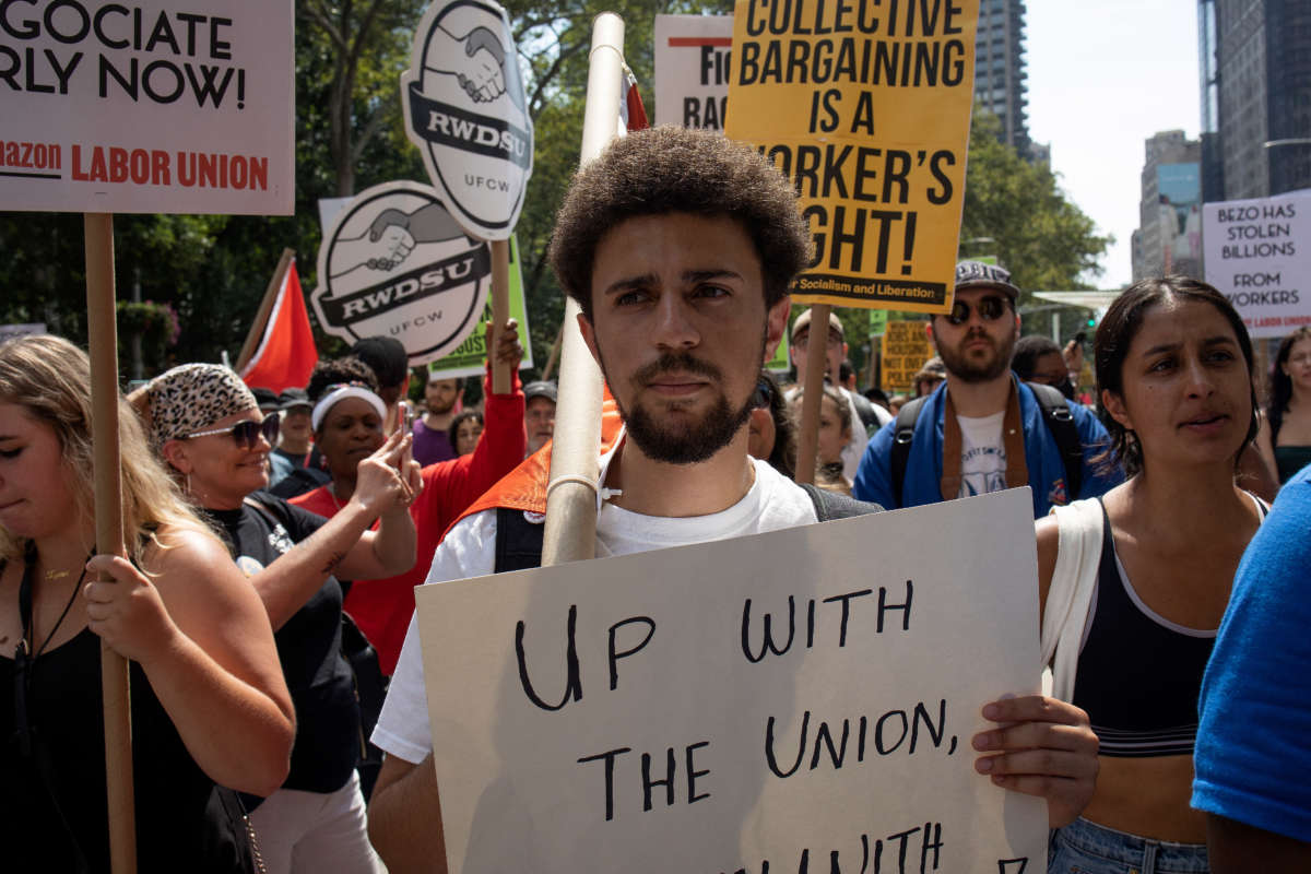 Amazon and Stabucks workers, supported by new service economy unions, march through the streets to protest union busting on Labor Day, September 5, 2022, in New York City.