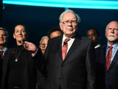 Warren Buffett, center, is joined onstage by 24 other philanthropist and influential business people featured on the Forbes list of 100 Greatest Business Minds during the Forbes Media Centennial Celebration at Pier 60 on September 19, 2017, in New York City.