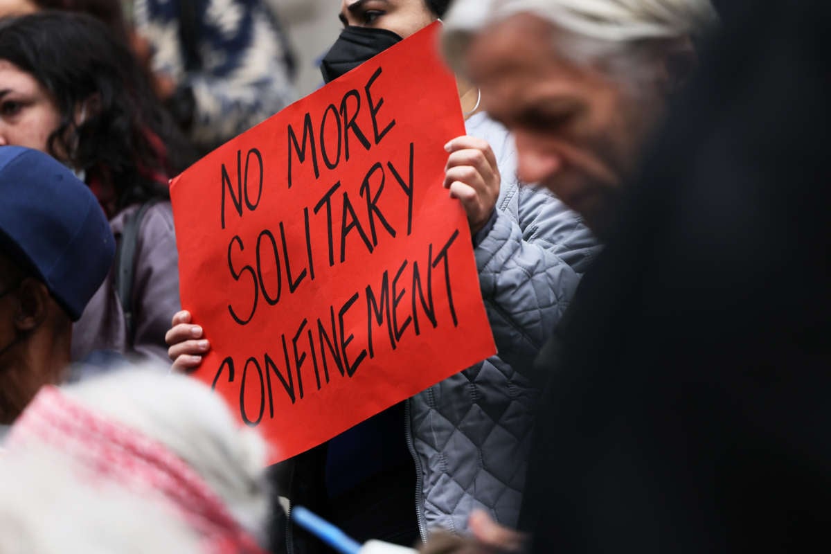 People gather for a rally to protest prison conditions at City Hall in New York City on October 25, 2022.