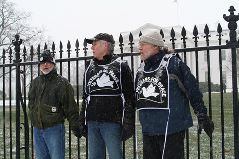 Activists move past the barricade to their goal:  the White House fence.