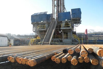 Sections of drilling pipe and a drilling rig on a six-well pad in the Piceance Basin of Colorado.