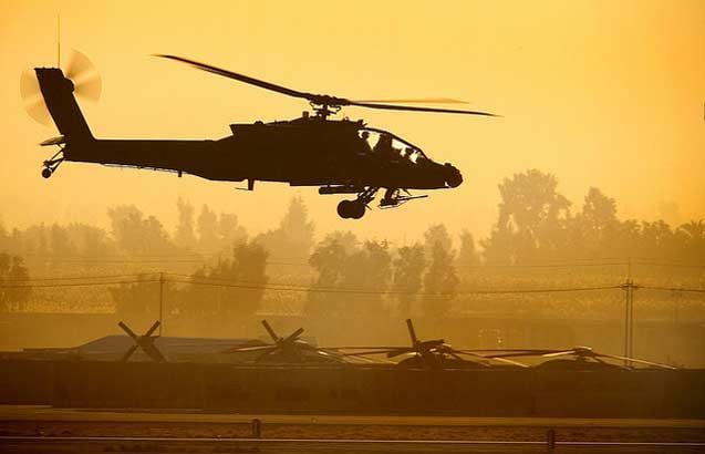 An AH-64 Apache attack helicopter hovers before takeoff from Balad Air Base, Iraq, Jan. 3, 2008.