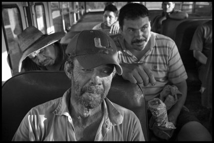 In the evening, workers return to the Royce Bone labor camp in a bus from the fields