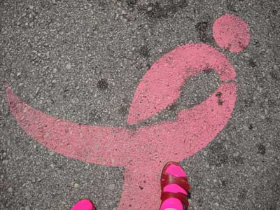 Pink ribbon on asphalt