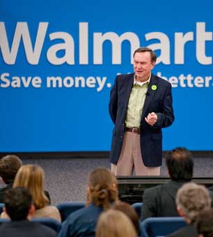 Walmart President and CEO Mike Duke speaks at the company's March, 2011 Sustainability Milestone Meeting. Duke has authorized early dividends to stockholders in anticipation of higher taxes next year while defending low wages for employees.