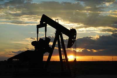 Oil pumping at sunset