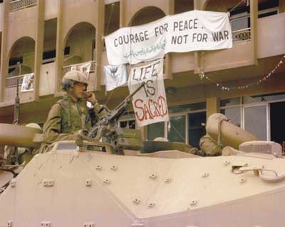 U.S. Marines occupy Baghdad in front of the Al Fanar hotel that housed Voices activists throughout the Shock and Awe bombing. (Photo: WNV/Iraq Peace Team)