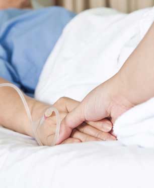 Patient holding hands