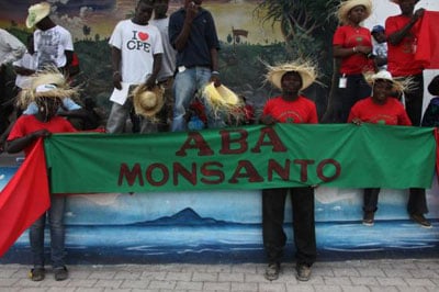 Down with Monsanto reads a banner as thousands marched for food sovereignty in Haiti, March 22, 2013. (Photo: Tequila Minsky © 2013)